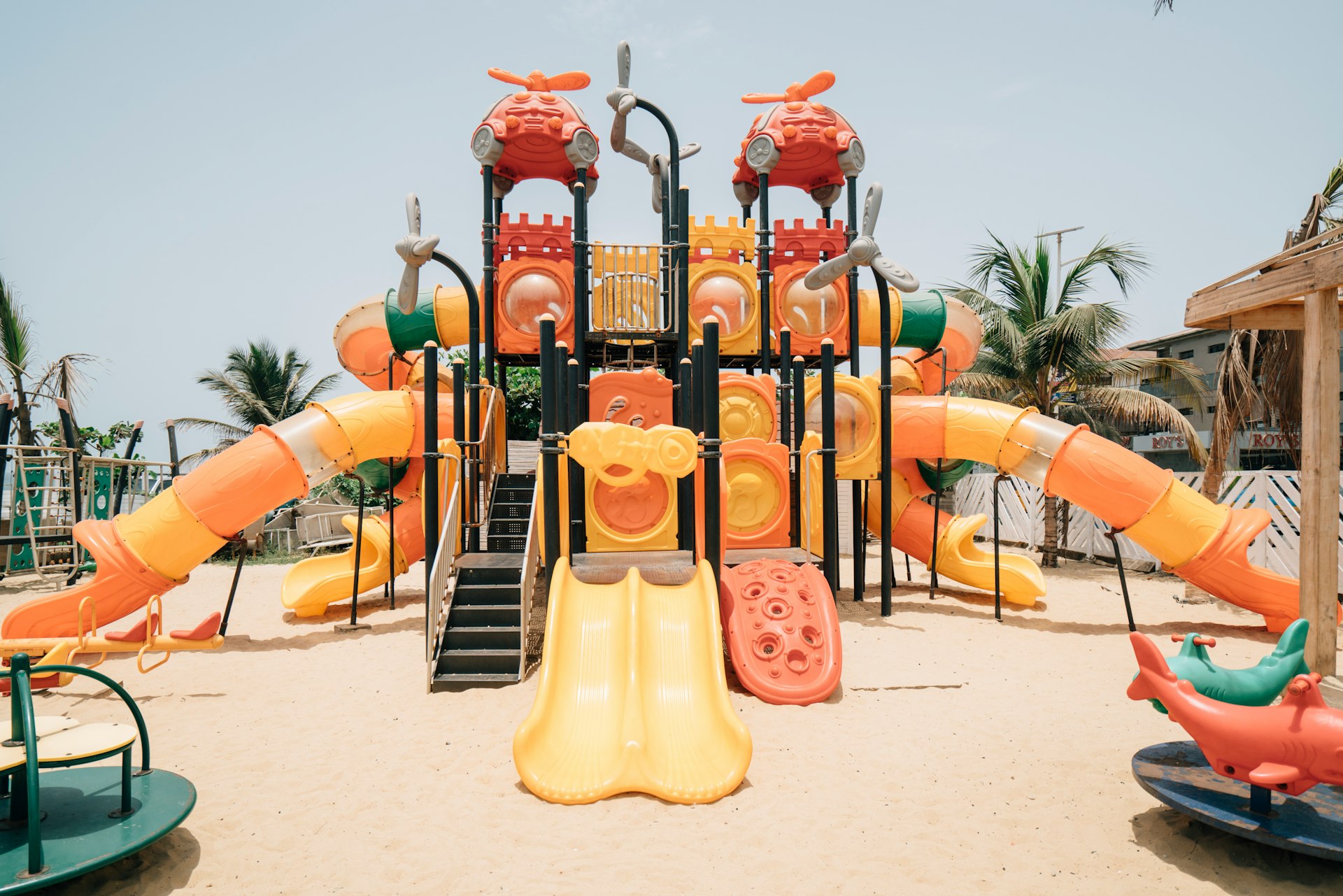 a children's play area with a slide and slides